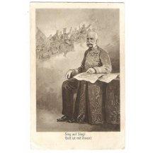 František Josef, sedící u stolu