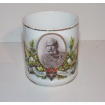 Černobílý portrét F.J. I. v rámečku s květinovým motivem